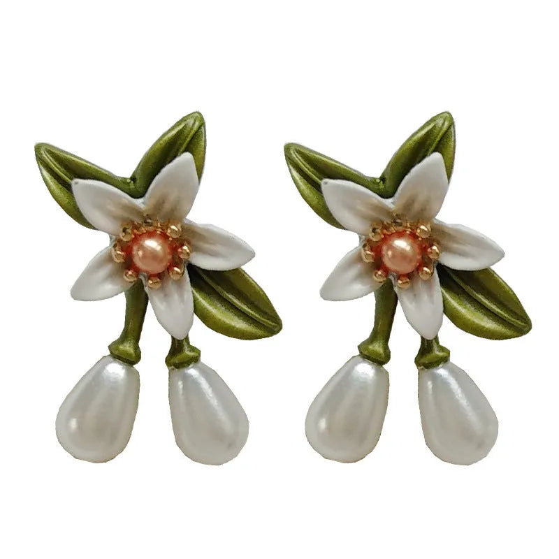 Women's camellia flower earrings in alloy with floral design and two colour options