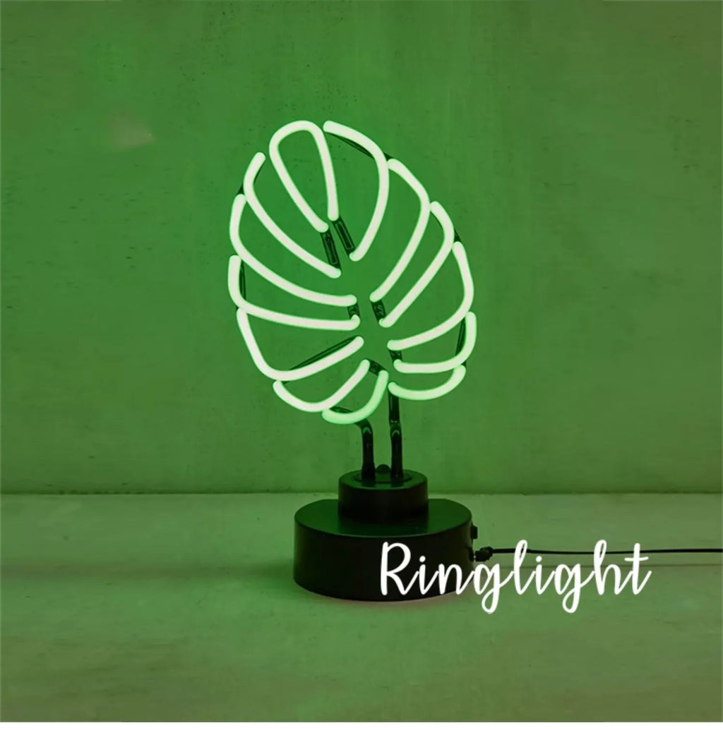 Minimalist bamboo-shaped desktop lamp with green light in white tube, showing large and small size options