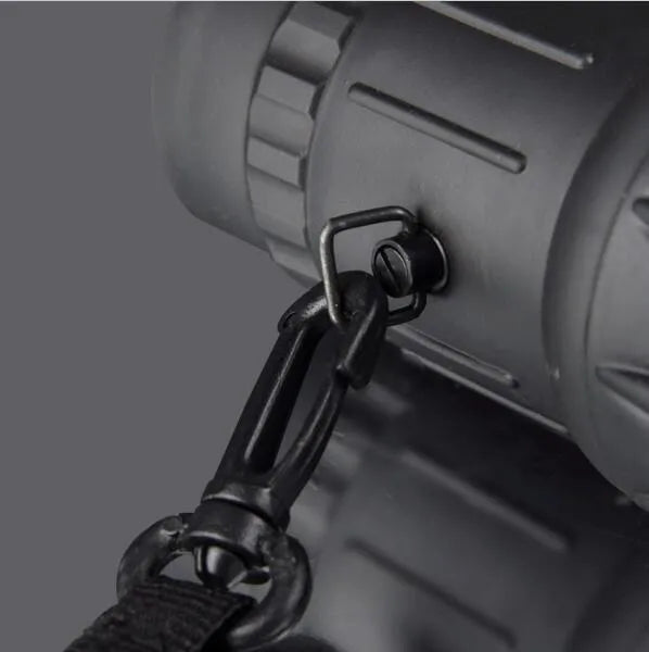 16x52 black monocular with BAK4 roof prism and green film coating on a white background