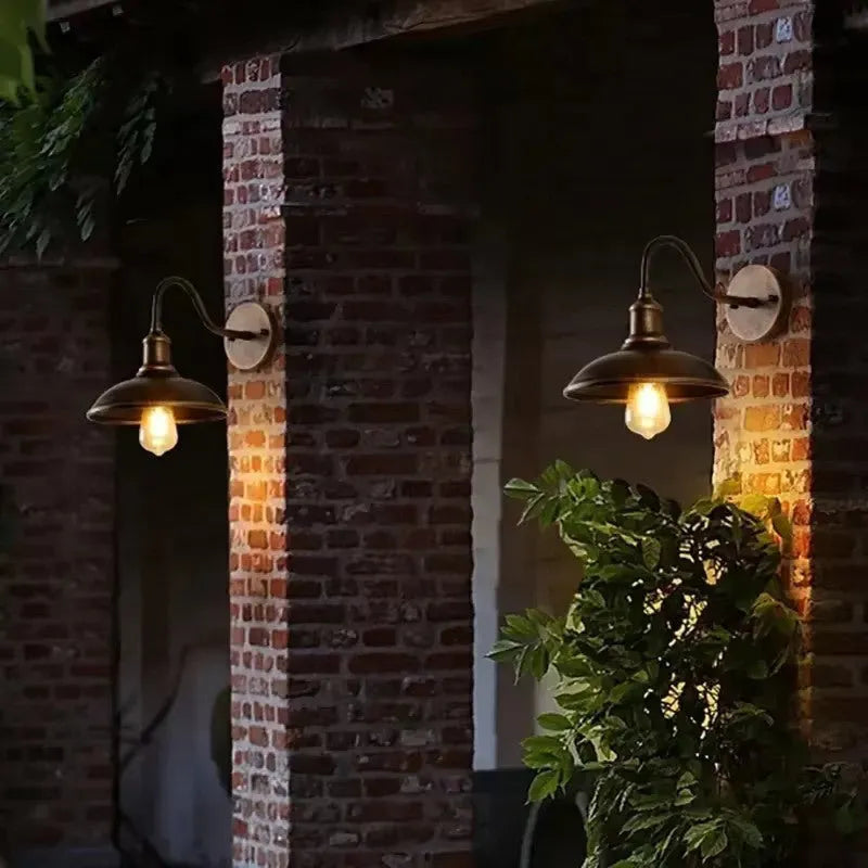 Retro-style metal wall lamp for a villa courtyard in a silver finish with right-angle mount.