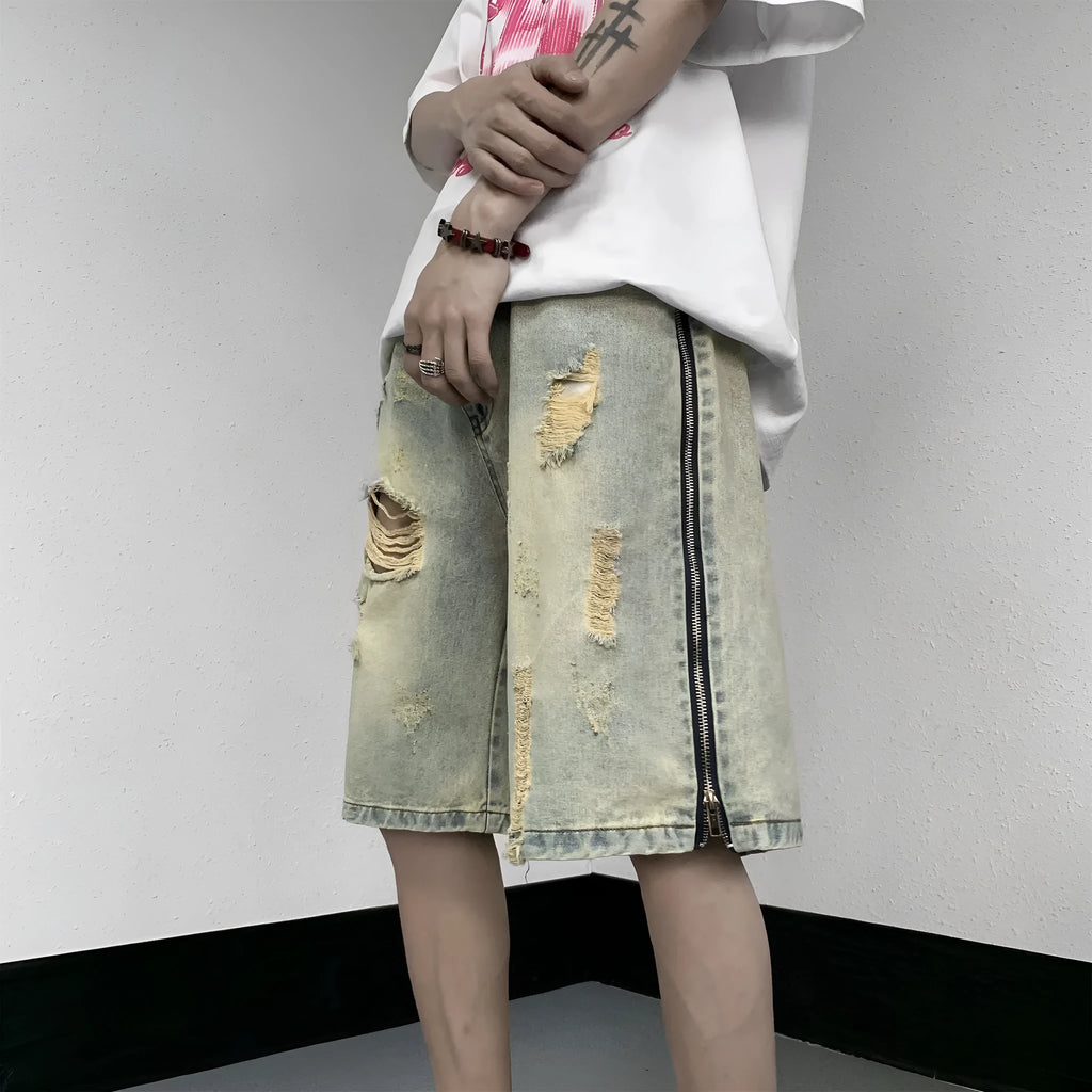 Men's blue denim shorts with loose five-point cut and yellow mud ripped detailing, button fly, straight leg