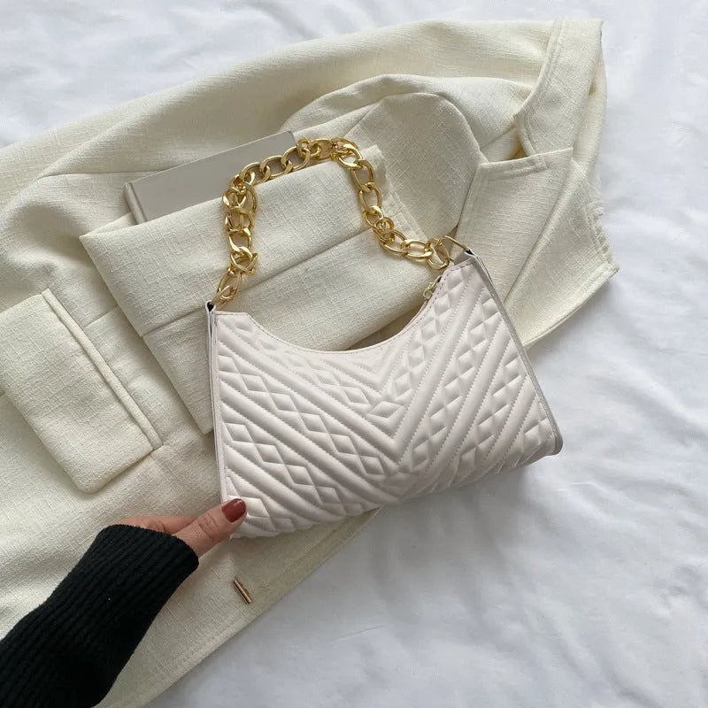 Brown pleated PU leather vertical square shoulder bag with a chain strap and soft handle.