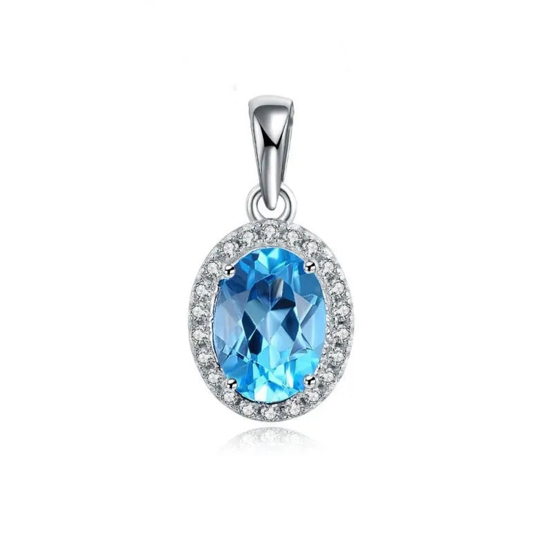 925 sterling silver jewellery set with blue topaz gems including geometric pendant necklace, earrings, ring, and bracelet.