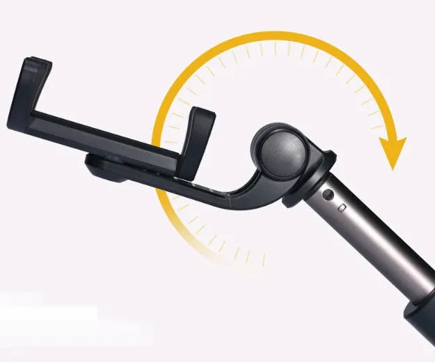 Black Bluetooth selfie stick tripod with remote control extended, holding a smartphone