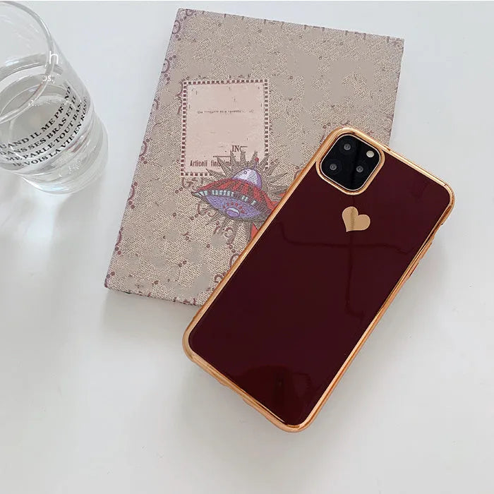 Solid colour blue TPU iPhone back cover case shown next to a claret pink and green version.