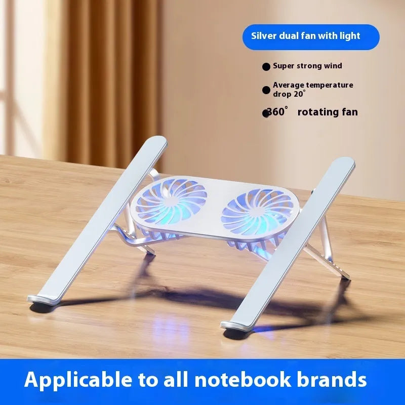 Silver aluminium laptop stand with twin cooling fans in folded position beside notebook computer