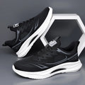 Men's low-top casual shoes in fly woven mesh, showing round toe and rubber sole, in black colourway.