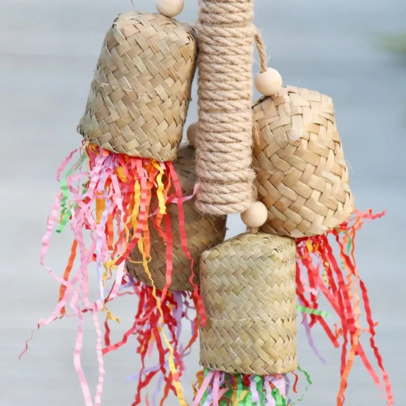 Wood and sisal parrot toy with shredded paper, measuring 15 by 35 centimetres