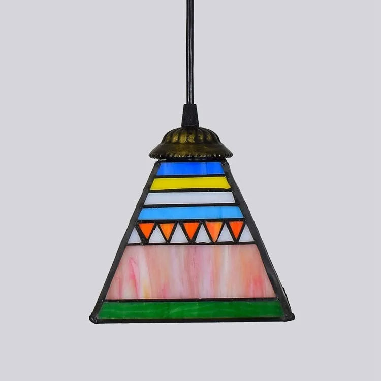 Small stained glass pendant light with coloured glass shade and long drop cable.