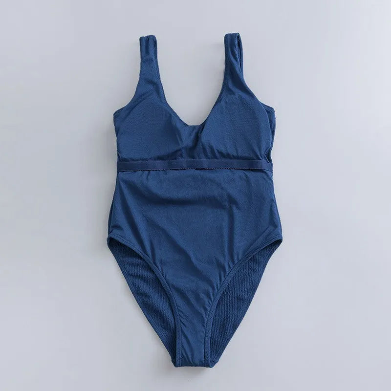 Navy blue women's one-piece slimming swimsuit with triangle design and chest pad support