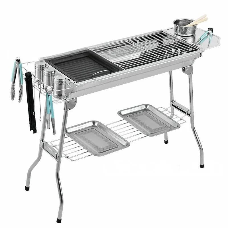 Stainless steel portable folding barbecue oven for outdoor cooking.