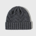 Women's wool knitted dome hat in various colours showing textured knit pattern and totem design elements