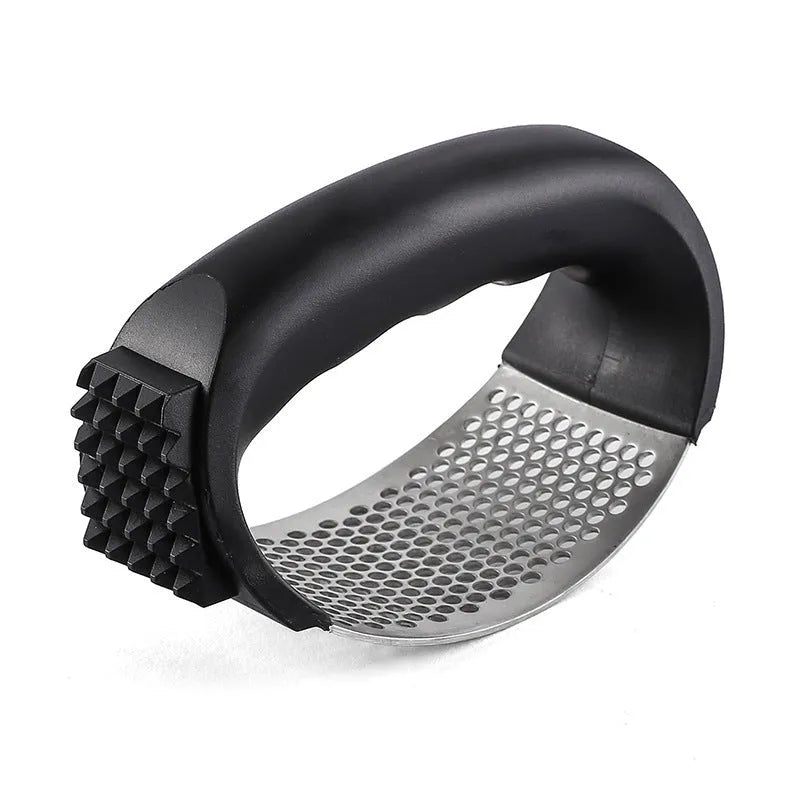 304 stainless steel garlic press 11x7cm in modern simple design on a kitchen counter