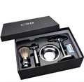 CSB men's shaving kit with badger hair brush, chrome safety razor, stand, soap bowl, and blades in a black box.