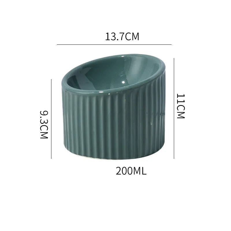 Elevated ceramic cat bowl in green colour showing tilted design and raised height for comfortable feeding