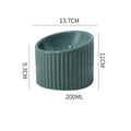 Elevated ceramic cat bowl in green colour showing tilted design and raised height for comfortable feeding