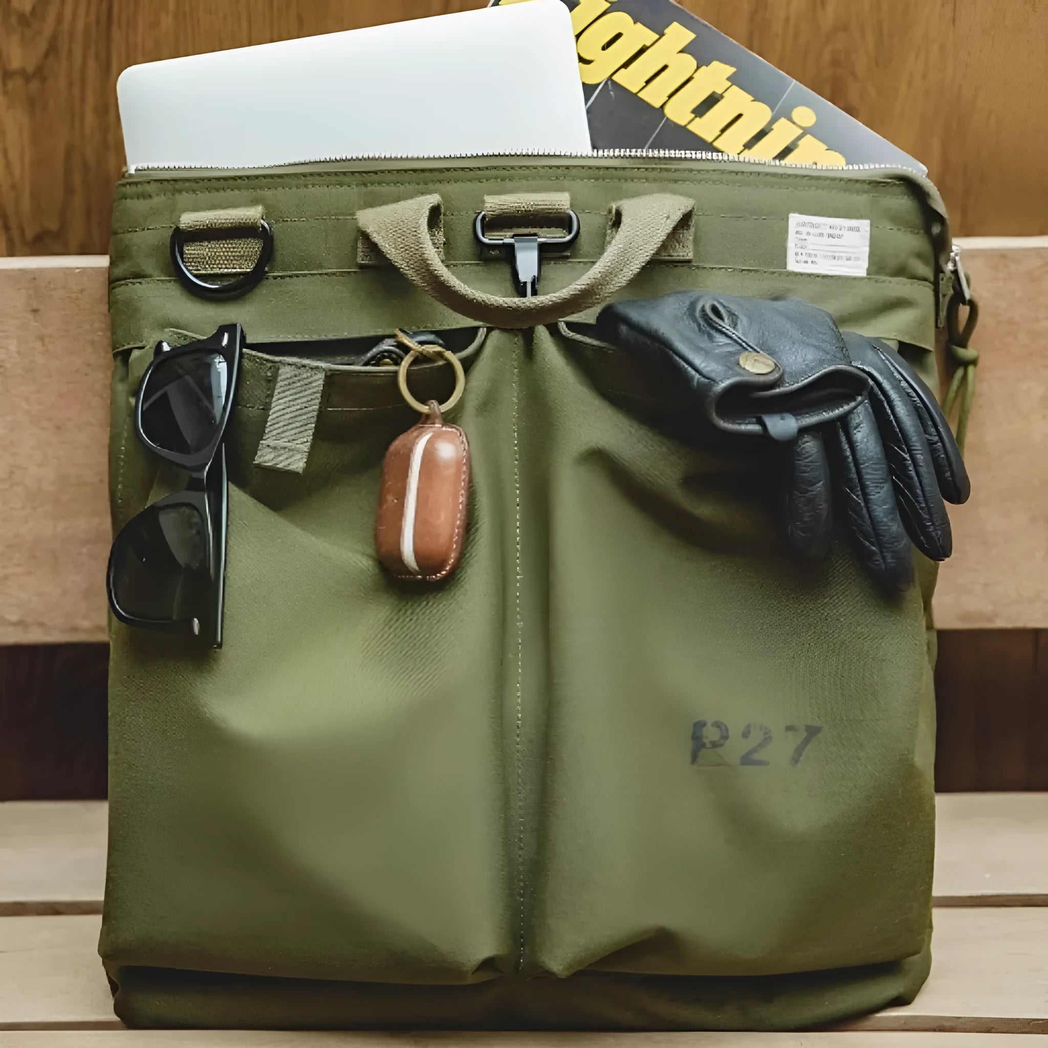 Canvas crossbody messenger bag in military green with 15 inch laptop compartment and shoulder strap
