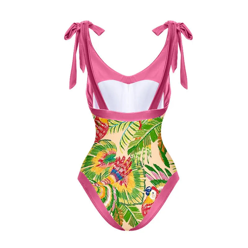 Retro pink floral print women's one-piece swimsuit with V-neck and attached thin skirt.
