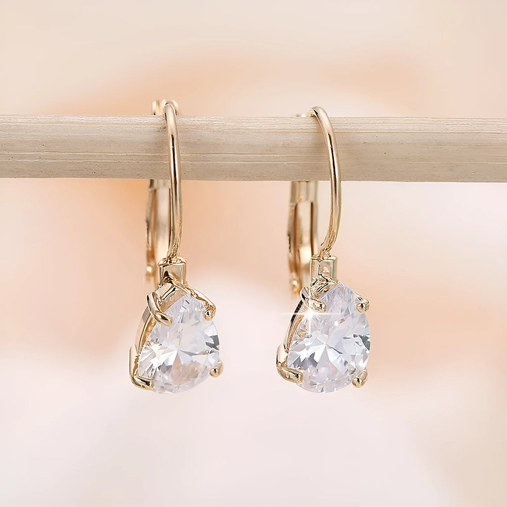Drop-shaped copper earrings with platinum gem decoration in gold and platinum colour options
