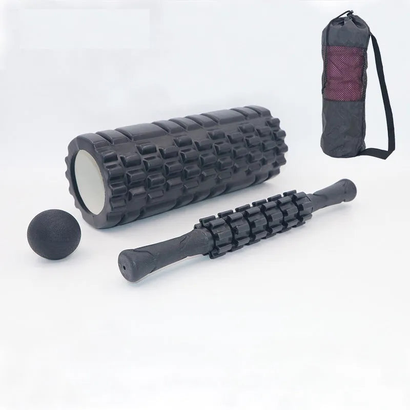 Black foam roller massage bar with gear-like segments, measuring 33cm in length