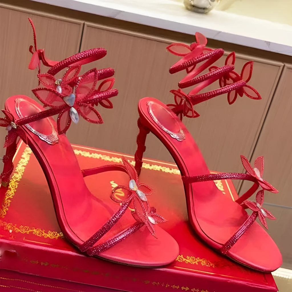 Snake butterfly rhinestone flower stiletto heel Roman sandals in gold with buckle closure and super high heel