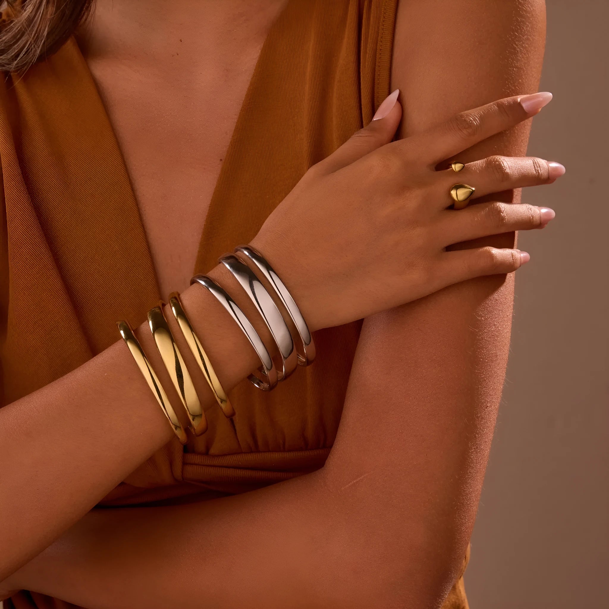 Stainless steel opening bracelet for women in gold or steel finish with geometric line design