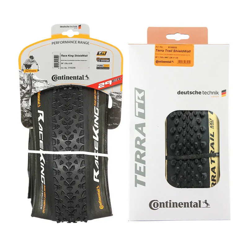 Mountain bike outer tyre showing yellow sidewall, labelled with sizes 26, 27.5, 29 inches and 2.0, 2.2 width options.
