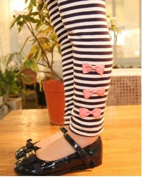 Pink cotton girls clothing set shown in sizes for children 110cm to 140cm tall.