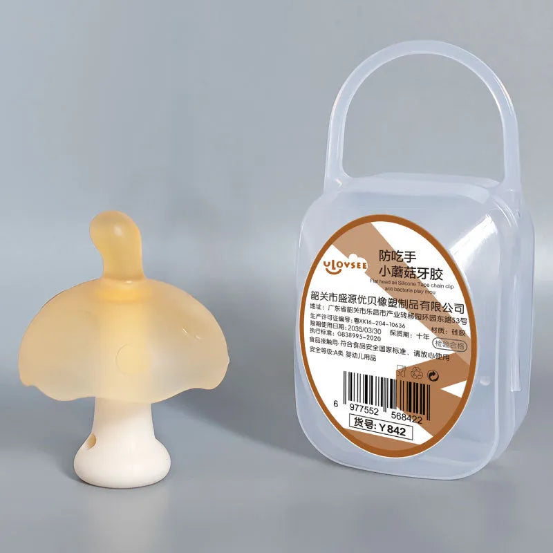 Small mushroom-shaped silicone gel chew toy in transparent storage box with nano chain attachment