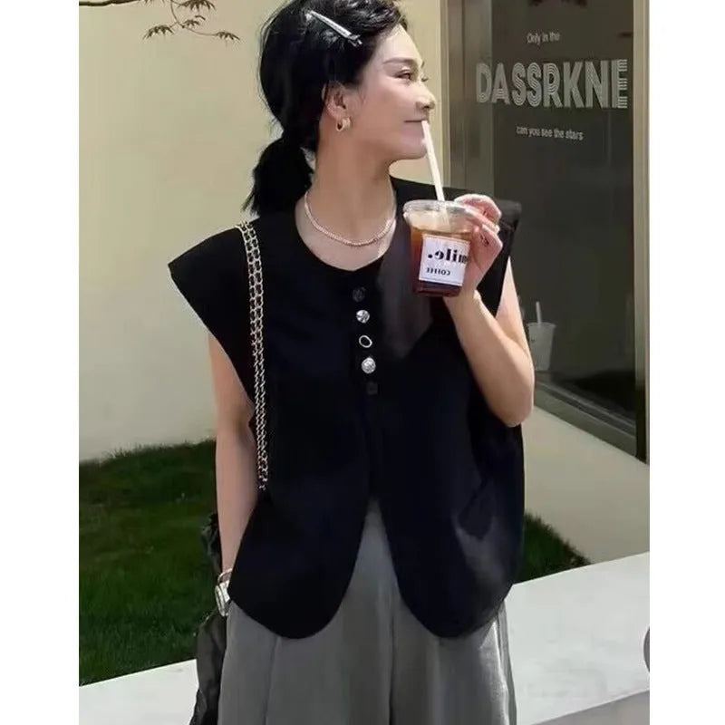 Women's loose fit polyester vest with pockets in milky white colour showing front view