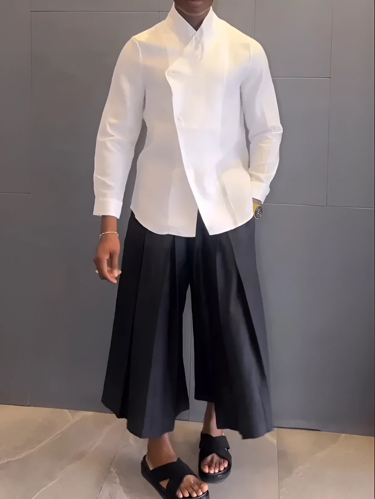 White asymmetric long sleeve shirt and black pleated pants set on model, regular fit, casual daily wear
