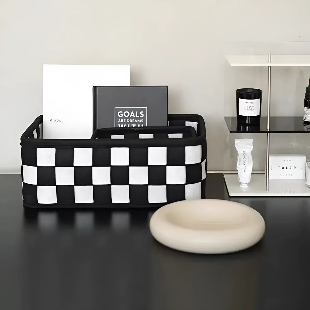 Checkerboard patterned foldable felt storage basket showing its woven texture and open-top design.