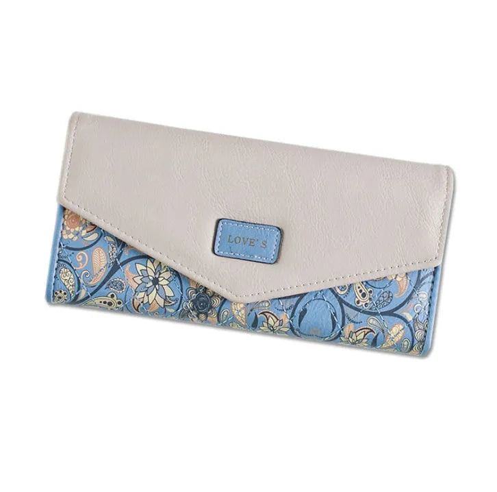 Women's black tri-fold PU leather wallet with buckle fastener showing open compartments.