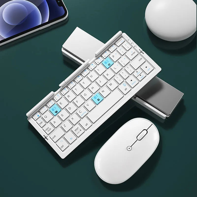 Silver folding Bluetooth keyboard propping up smartphone with hidden stand extended
