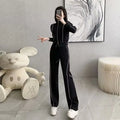 Women's two-piece set with short zipper sweater and wide leg trousers in solid colour polyester, black and white options available