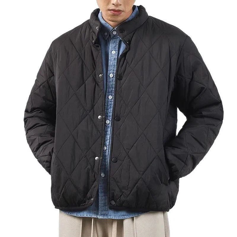 Men's black diamond lattice pattern winter jacket showing lengthened cut and medium thickness