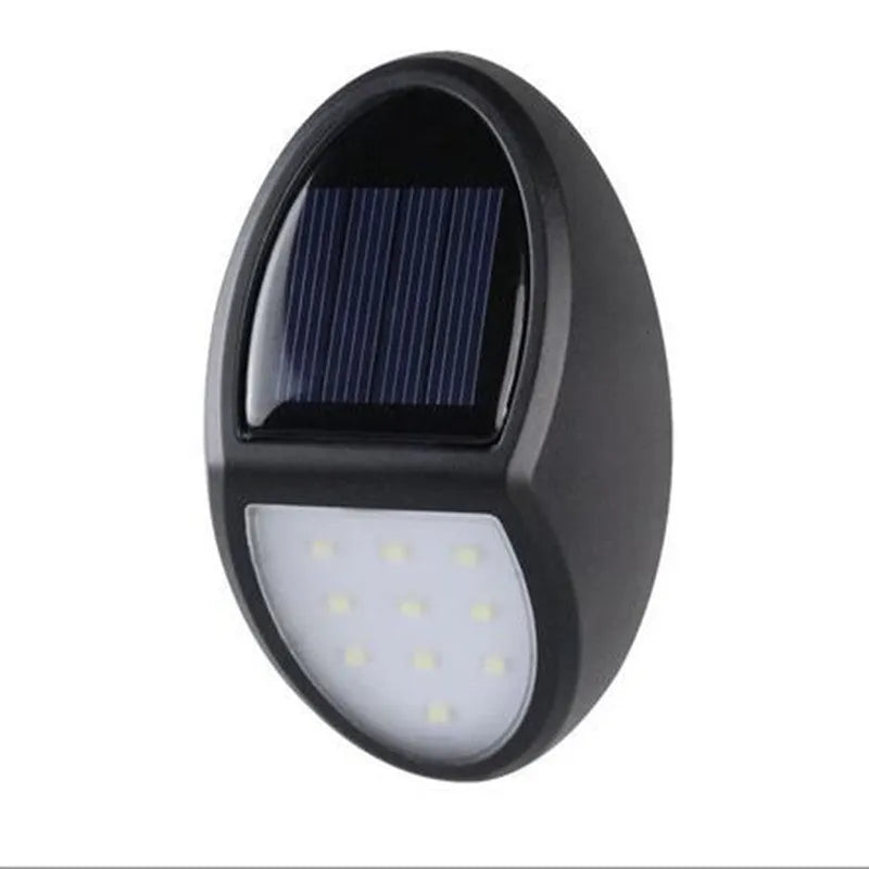 Black solar-powered wall light with automatic sensor for garden and outdoor security lighting
