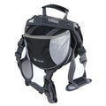 Black dog hiking pack with reflective tape and adjustable neck straps on Siberian Husky outdoors