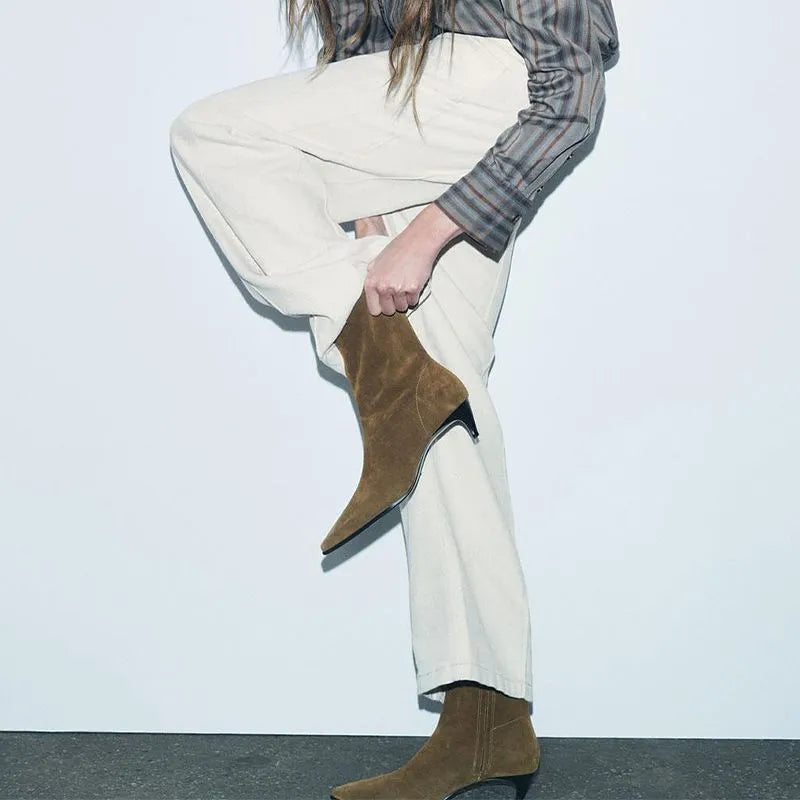 Women's brown square toe ankle boots with a stiletto heel and side zipper on a white background