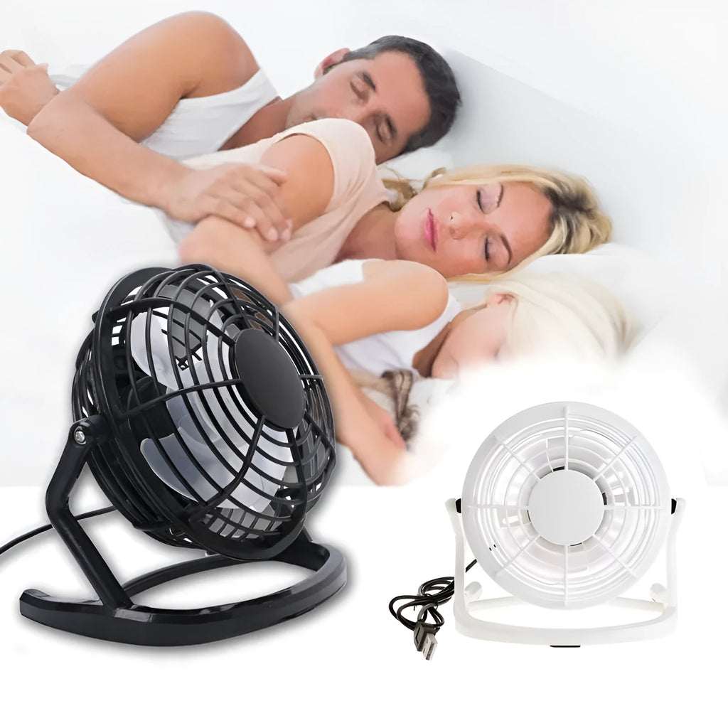 Mini black USB desk fan with adjustable angle for laptop cooling on wooden desk