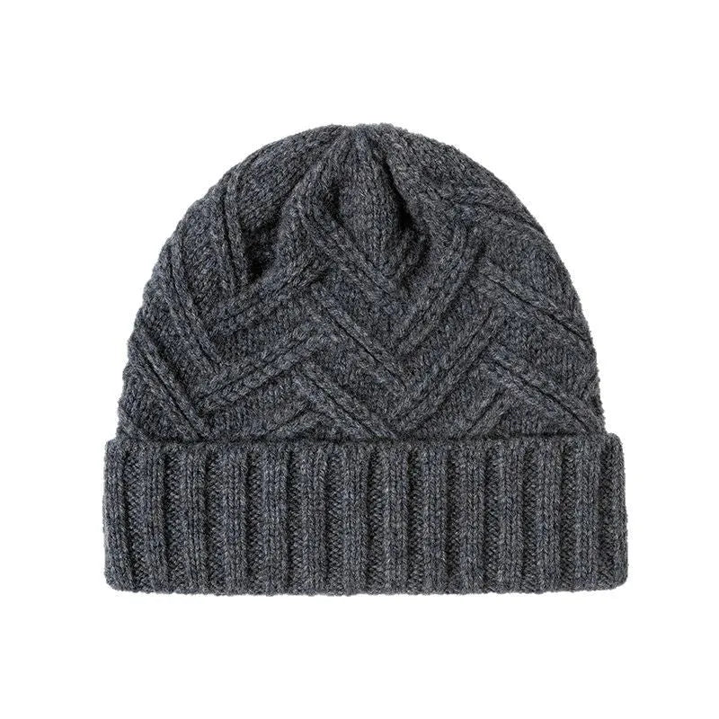 Women's wool knitted dome hat in various colours showing textured knit pattern and totem design elements