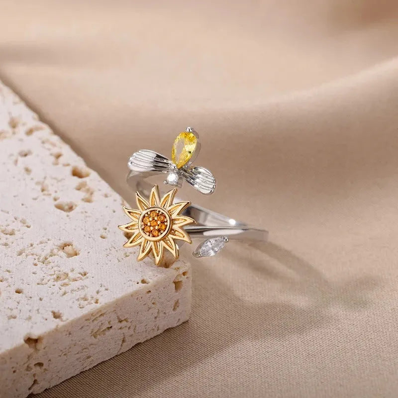 Simple geometric decompression ring with adjustable opening in gold electroplated finish