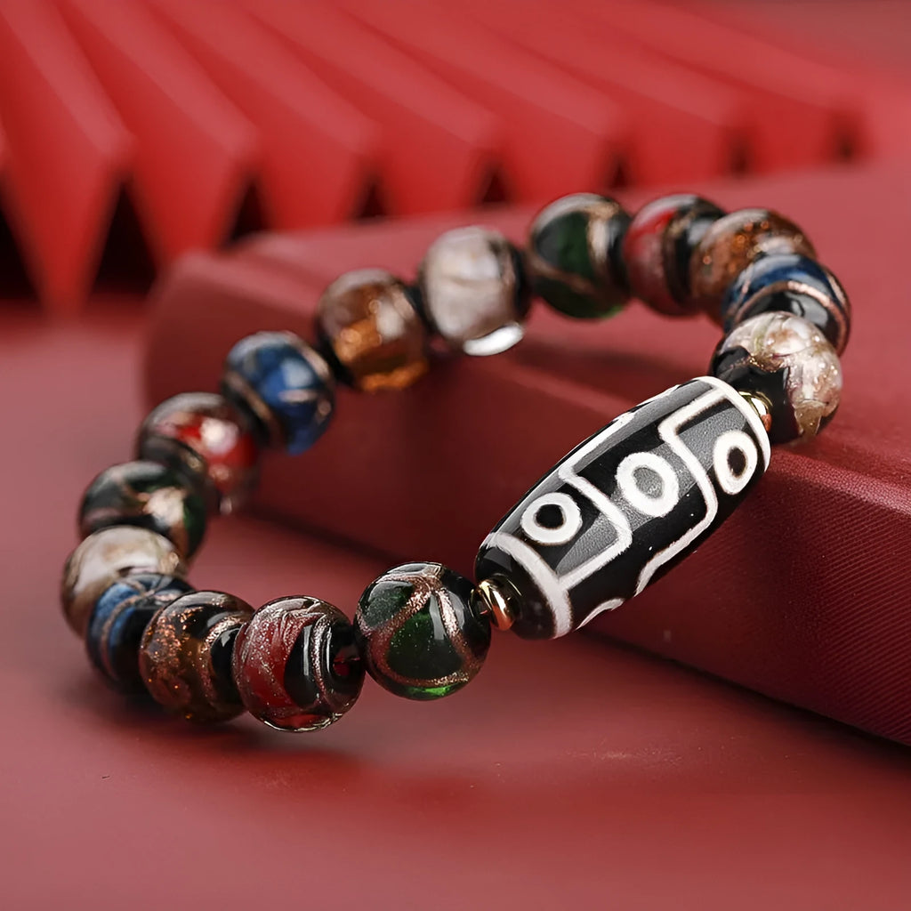 Snake year lucky bracelet with multicoloured glazed beads in Chinese auspicious patterns.