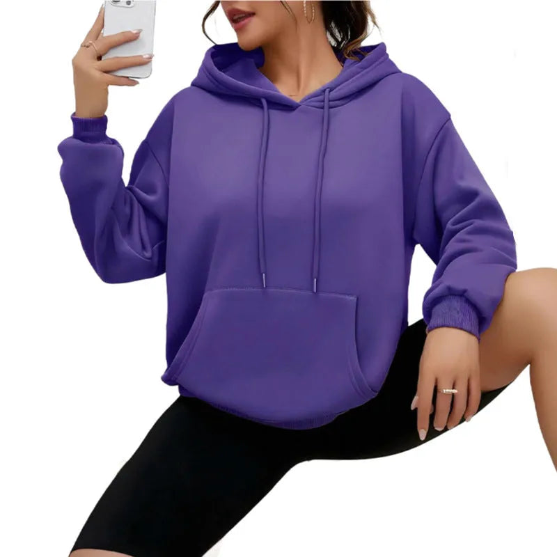Women's loose black drawstring pocket sweatshirt with long sleeves and a front kangaroo pouch.