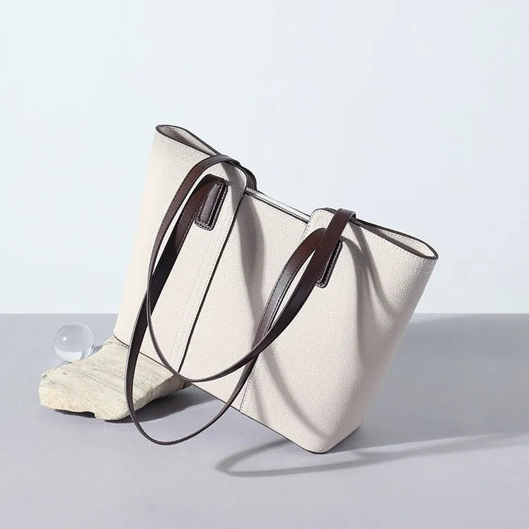 Genuine leather women's commuter shoulder bag in a box-type shape with a large capacity and sandwich pocket.