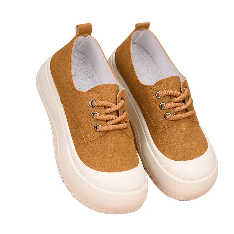Women's camel suede platform loafers with round toe and front lace-up on a flat rubber sole.