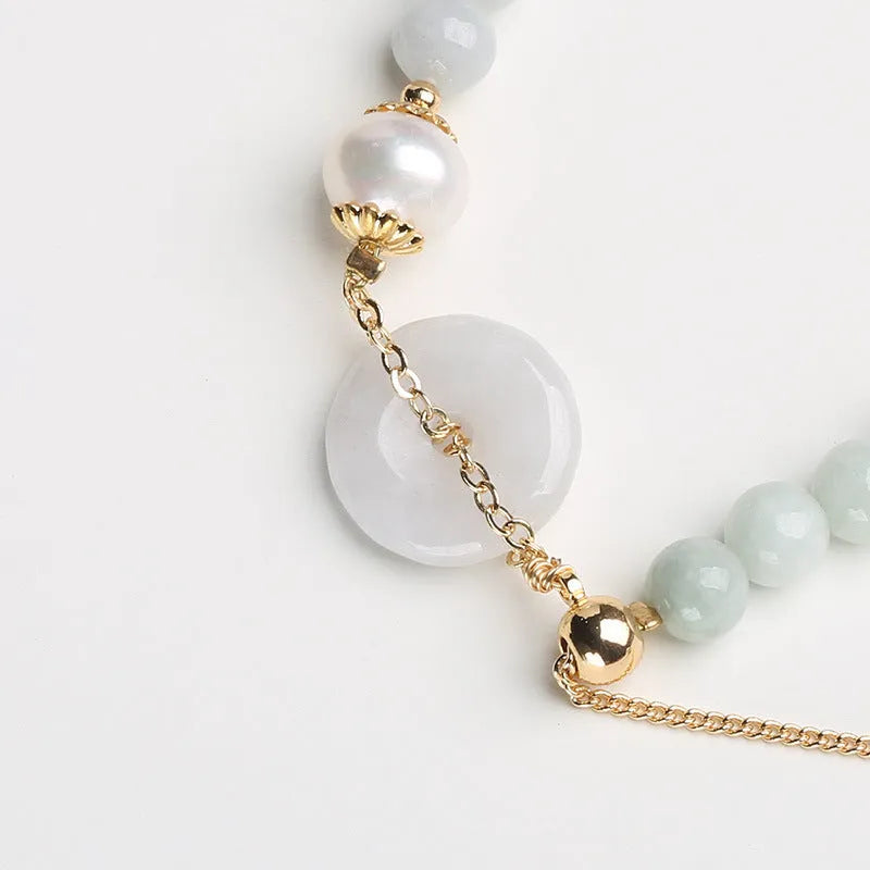 Women's natural emerald jade pearl bracelet with geometric design and traditional Chinese styling