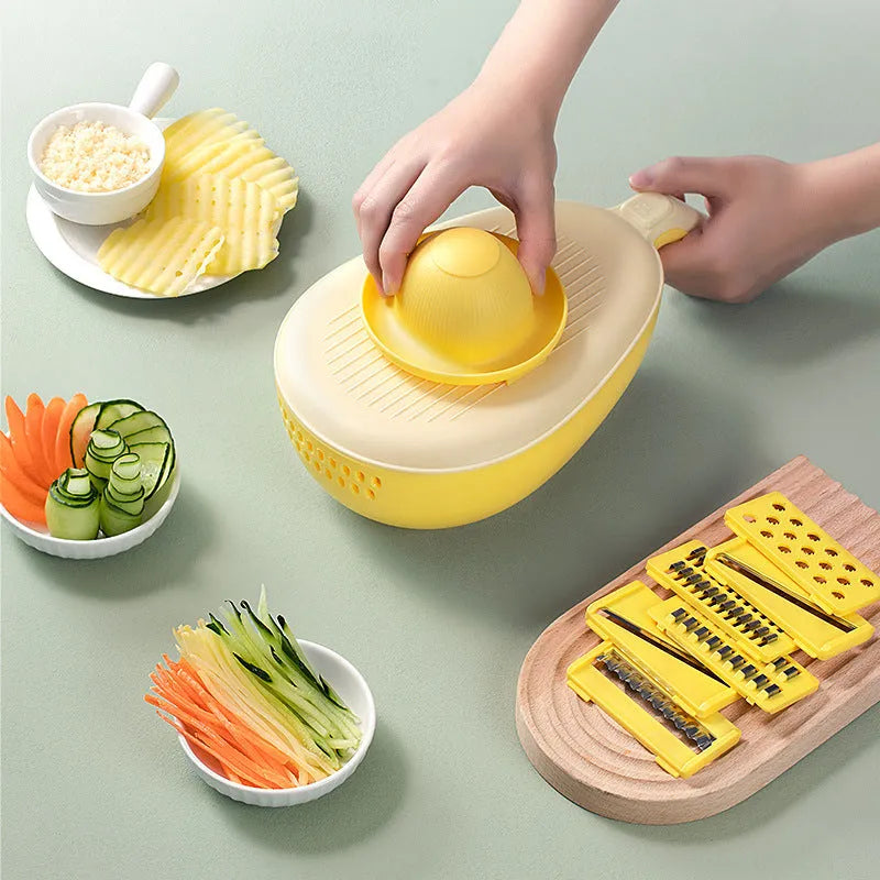 Vegetable grater slicer with six sabres and bottom storage box in avocado green colour on a kitchen counter