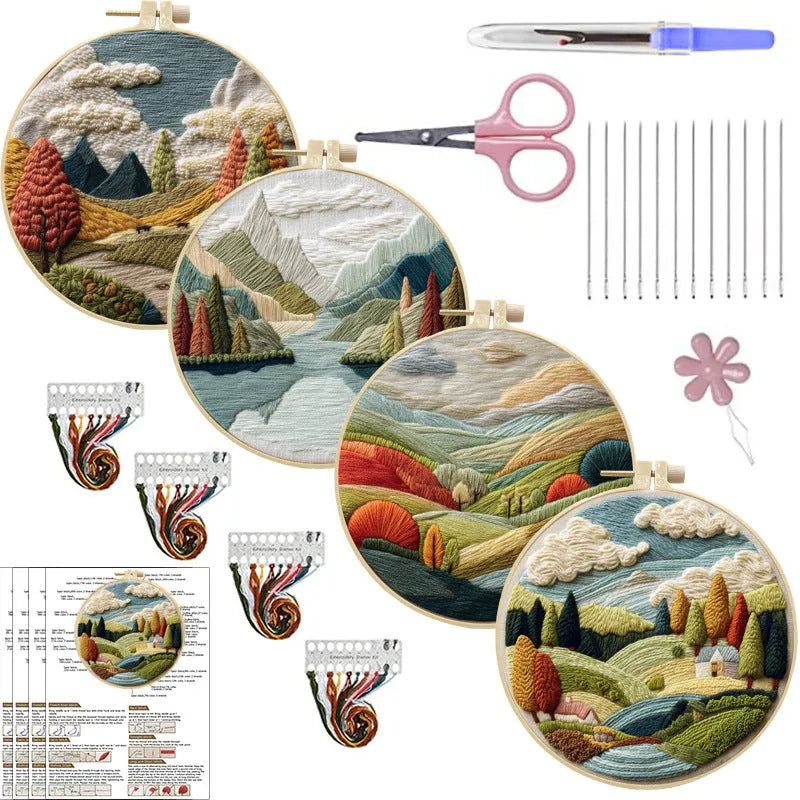 Embroidery kit with printed landscape design fabric, coloured thread, needles, and bamboo frame