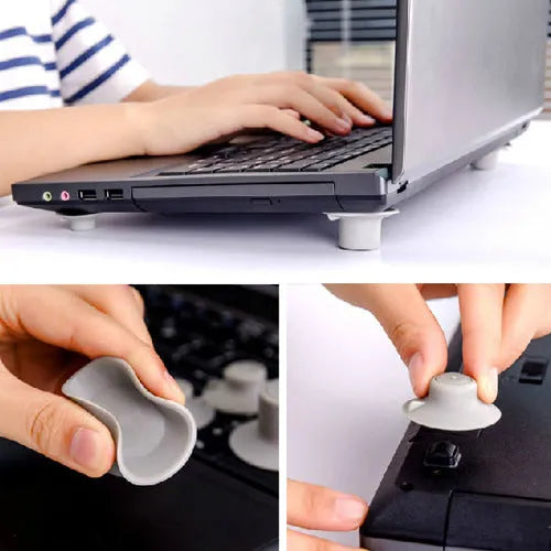 Four grey plastic non-slip laptop cooling pads, two large and two small, on a desk.